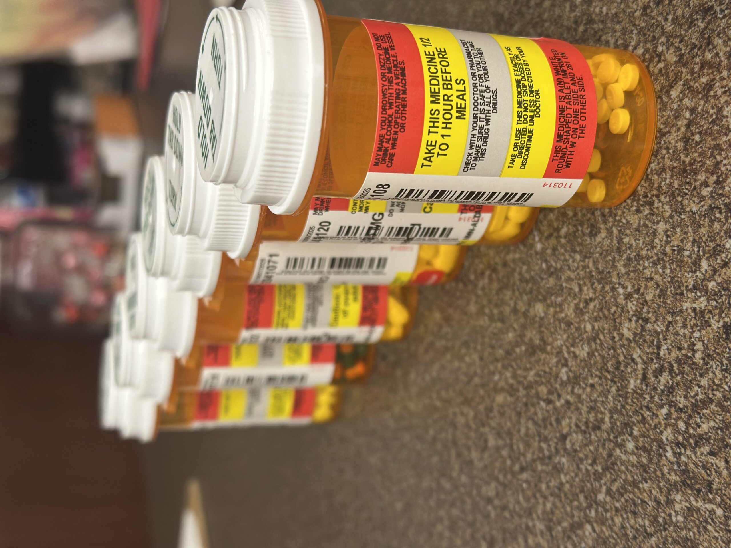 Prescription medication bottles with clear pharmaceutical labels for dosage and safety instructions